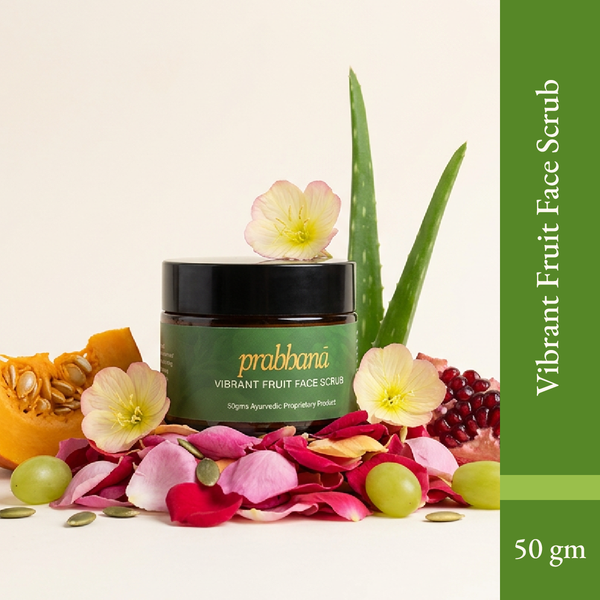 Vibrant Fruit Face Scrub jar with green label, surrounded by fruits, petals, and aloe vera leaves.