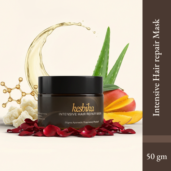 Intensive Hair Repair Mask in a dark jar with a gold label, surrounded by aloe vera, mango, and rose petals.